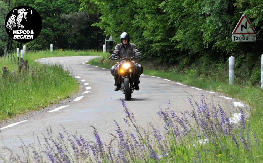  Street C-Bow mounted motorcycle softbags from Hepco & Becker, verastile, light weight & secure.  Seen here on KTM 690 Duke and imported by Motorcycle Adventure Products.